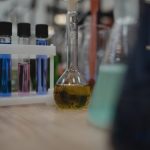 Vibrant laboratory setup with test tubes and flasks filled with colored liquids.