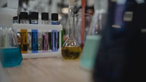 Vibrant laboratory setup with test tubes and flasks filled with colored liquids.
