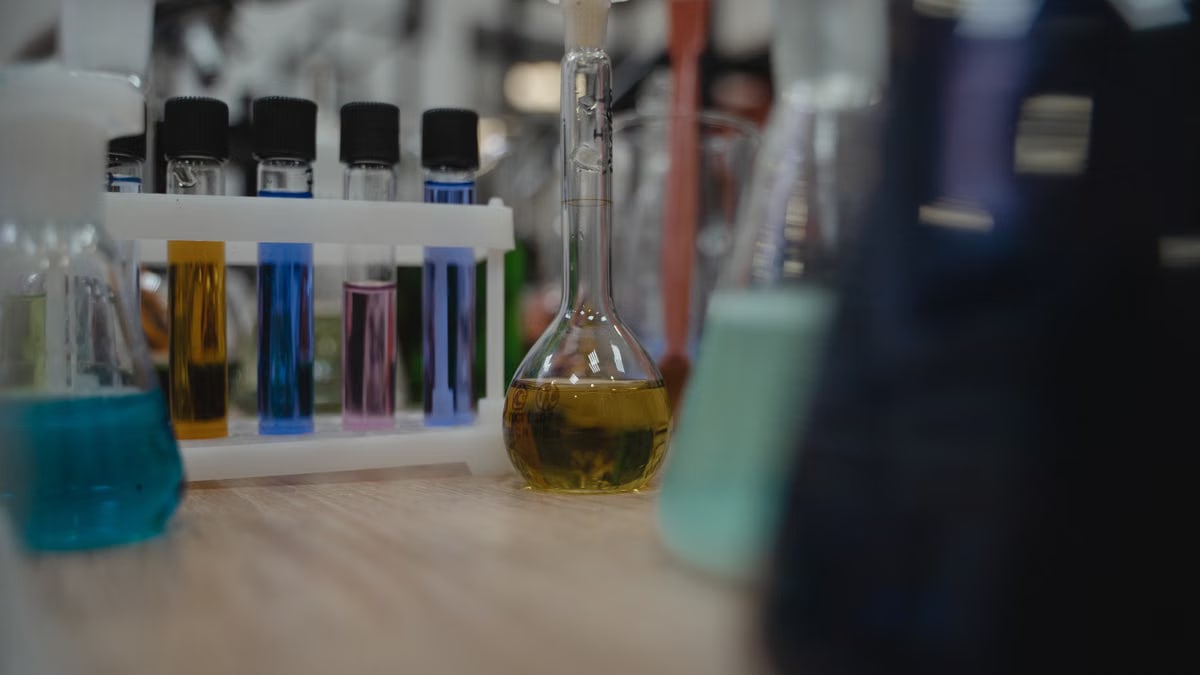 Vibrant laboratory setup with test tubes and flasks filled with colored liquids.